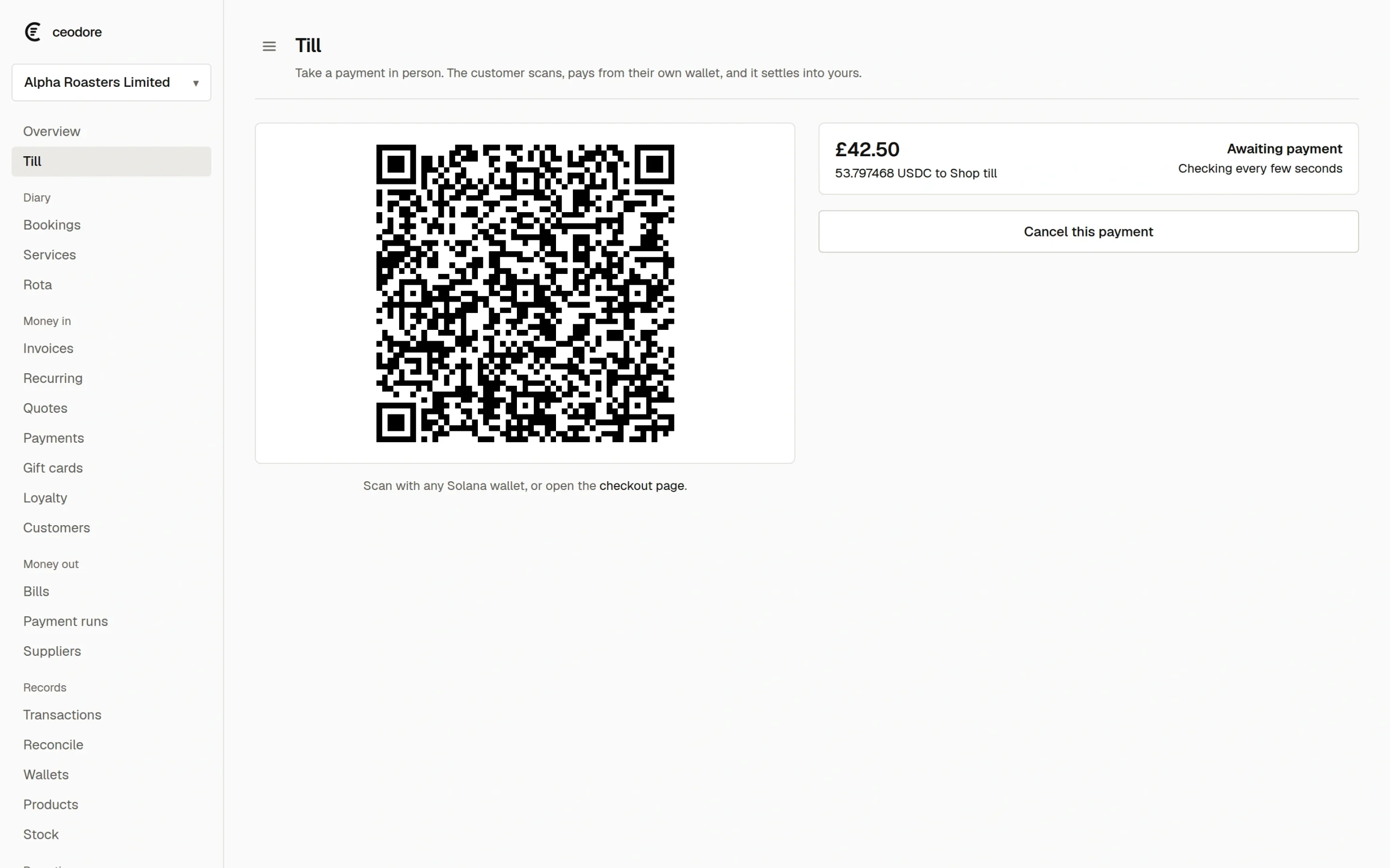 The Ceodore till showing a £42.50 sale with a Solana Pay code on screen, awaiting settlement.